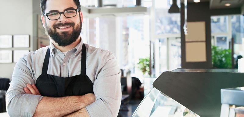  Bearded Barista with Glasses at coffee shop 